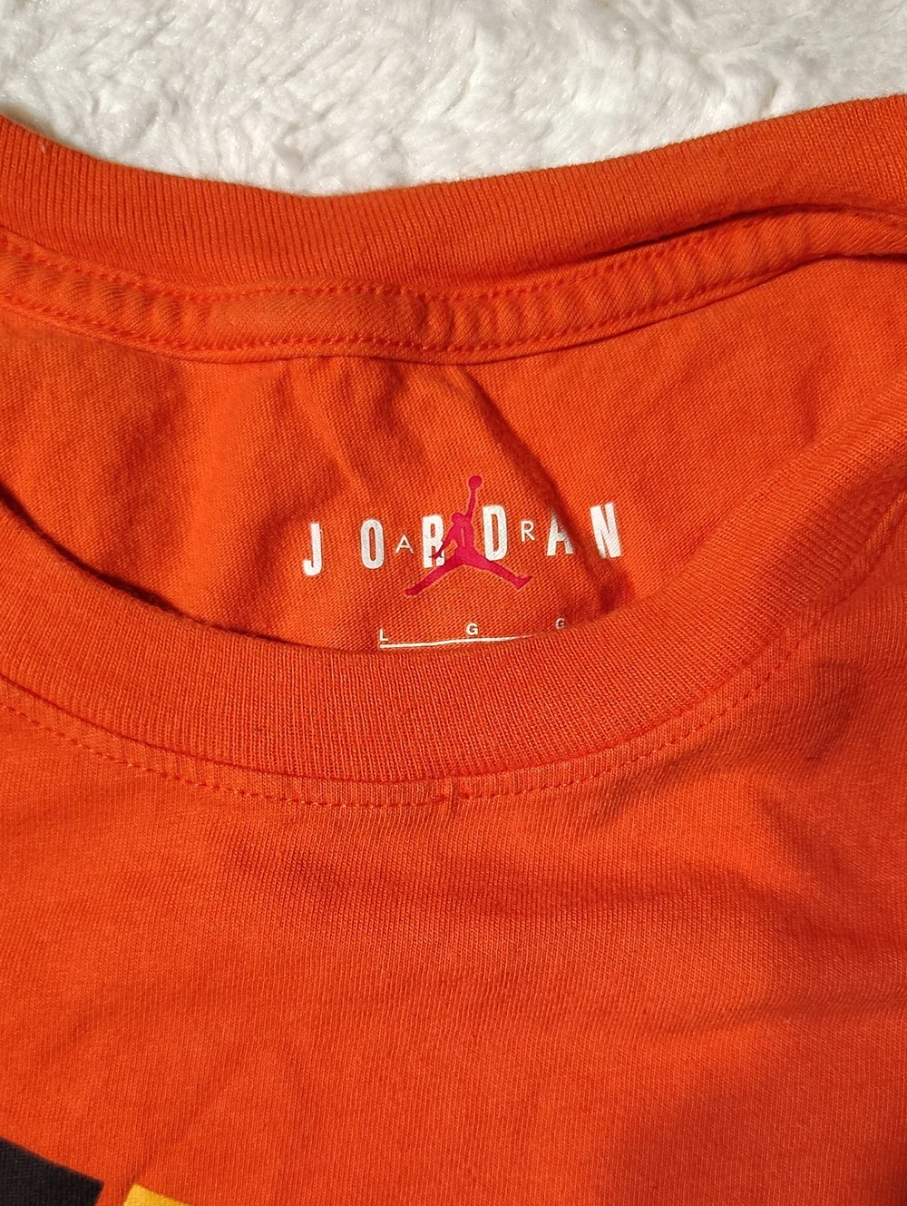 Jordan Orange Short Sleeve Tee with Black Jumpman and Yellow Frame